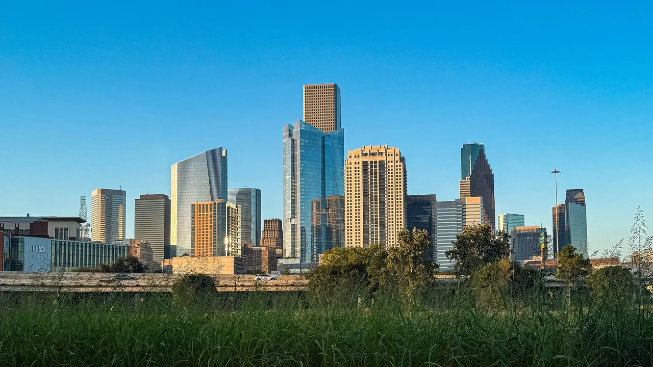The Houston skyline under a clear sky.